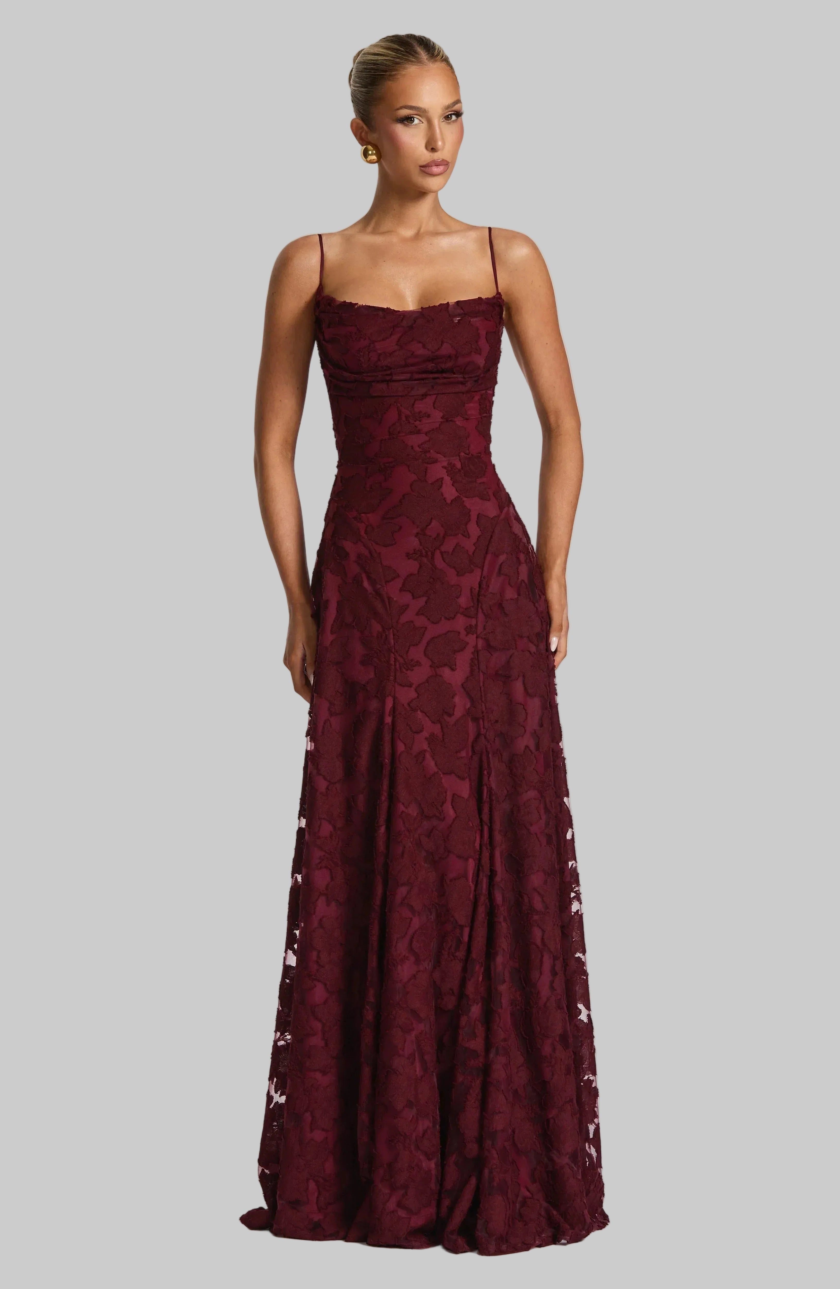 Floral Lace Maxi Dress with Lace-Up Back, Spaghetti Straps, Fitted Bodice. Available in Burgundy, White, and Pink. — Main Image
